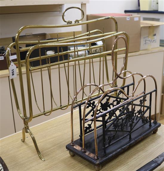 A Victorian cast iron and copper magazine rack and a brass rack